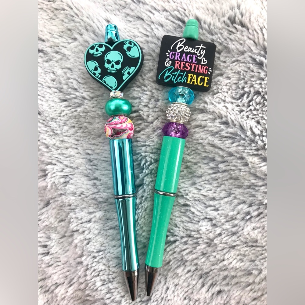 Beauty Grace Resting Face pen and teal skull pen